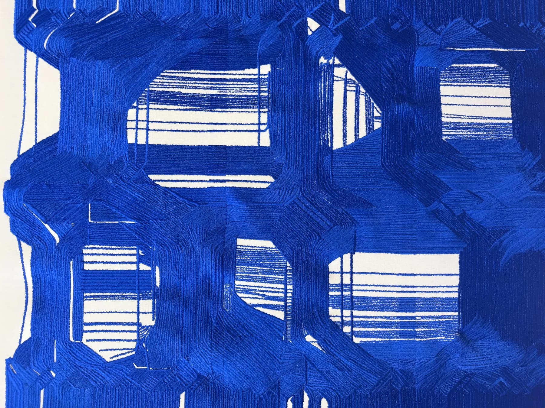 Aura Mare (detail) — close-up of layered ultramarine thread, revealing overlapping paths and variations in stitch density