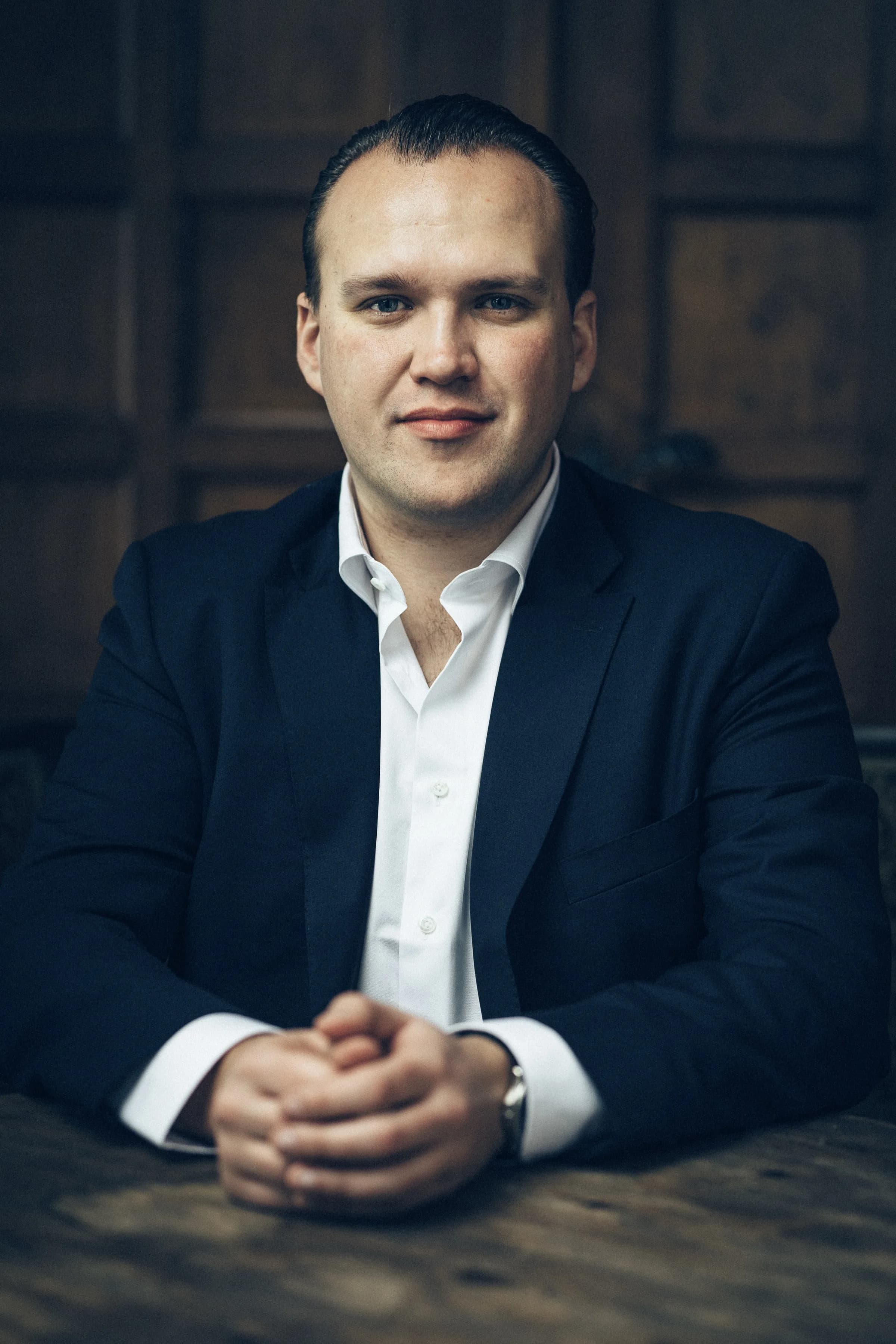 Black and white portrait of Richard Nadler with dramatic side lighting